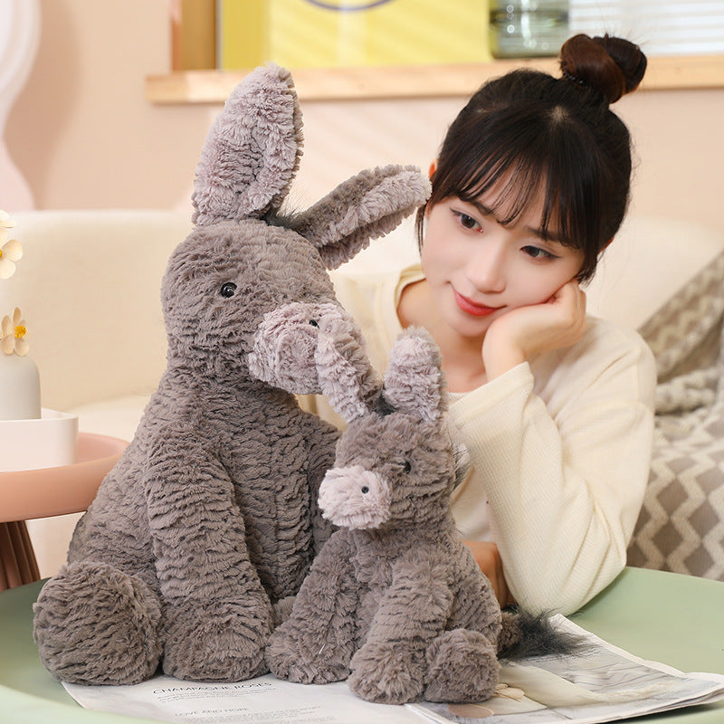 Bonito burro de peluche y almohada para abrazar